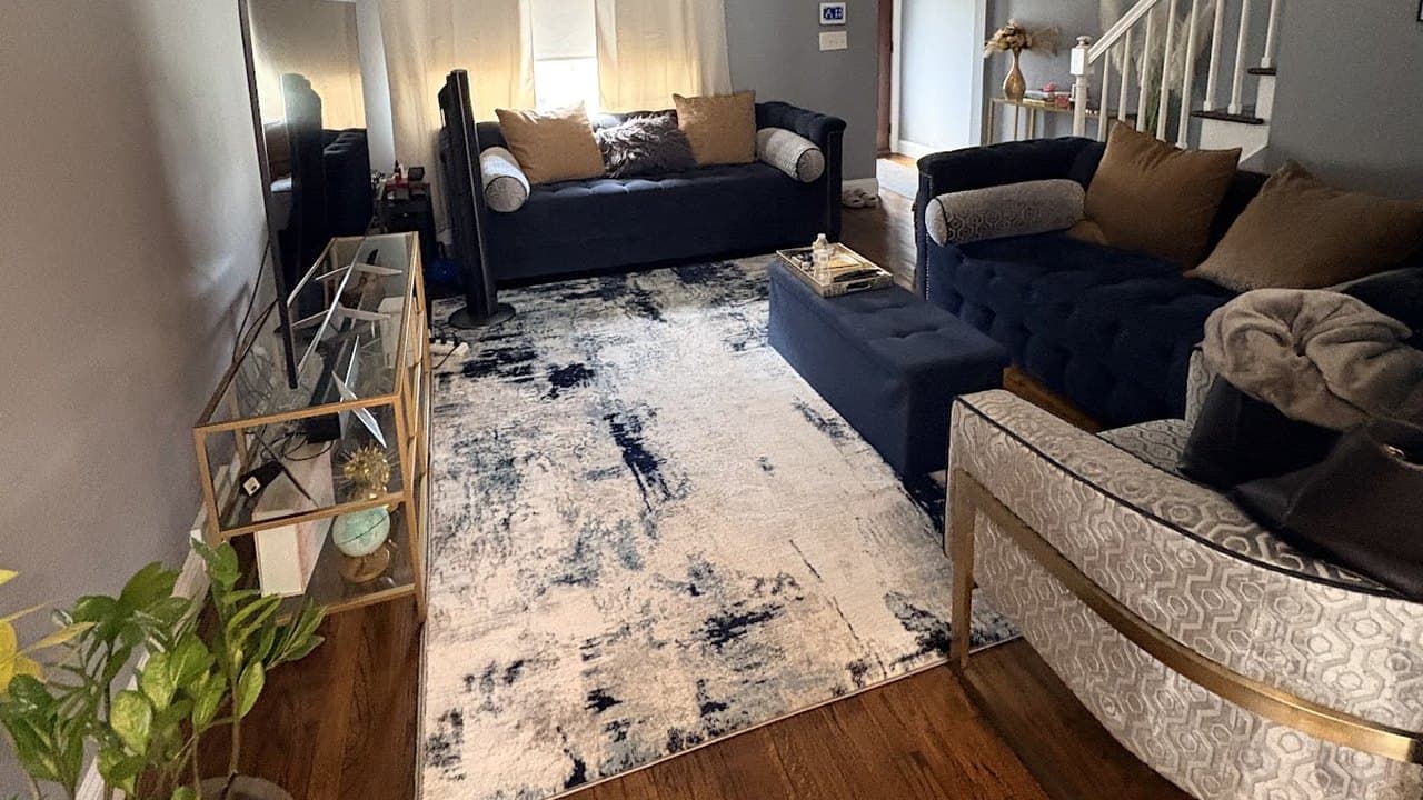 Tidy living room with vacuumed rug and polished hardwood floors